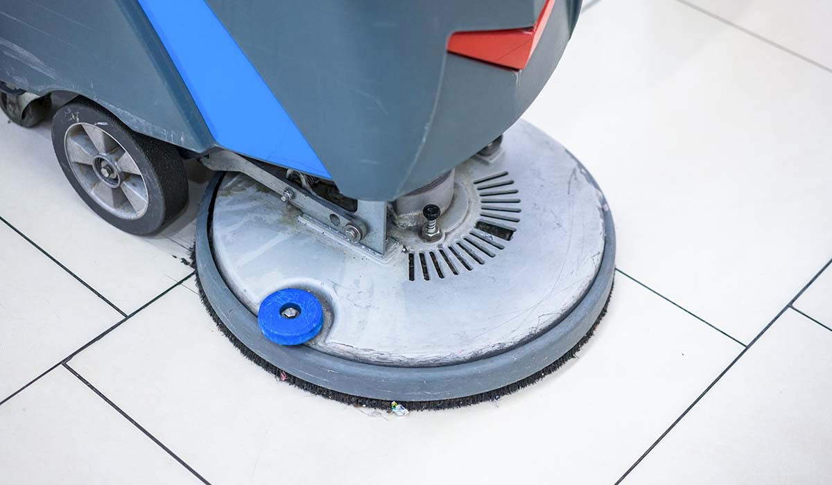 photo showing a tile floor being polished after cleaning